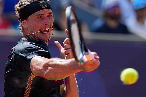 Alexander Zverev of Germany returns a shot to Tomas Machac